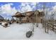 Spacious backyard with pergola, patio furniture, and fire pit, perfect for outdoor entertaining at 42280 Kingsmill Cir, Elizabeth, CO 80107