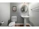 Elegant powder room with pedestal sink and tile flooring at 42280 Kingsmill Cir, Elizabeth, CO 80107