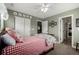Small bedroom with twin bed, and red and white bedding at 42280 Kingsmill Cir, Elizabeth, CO 80107