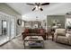 Gathering Room with open floor plan and view into the kitchen at 42280 Kingsmill Cir, Elizabeth, CO 80107