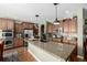 Kitchen boasts granite countertops and ample cabinet space at 42280 Kingsmill Cir, Elizabeth, CO 80107