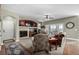 Living room with fireplace, access to a back porch, and hardwood flooring at 42280 Kingsmill Cir, Elizabeth, CO 80107