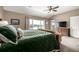 Main bedroom with a king-size bed and access to a balcony at 42280 Kingsmill Cir, Elizabeth, CO 80107