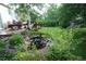 Lush backyard pond featuring a beautiful deck space with outdoor seating at 248 Summit Trl, Broomfield, CO 80020