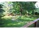The backyard has a lovely stone path, lush lawn, and view from the deck at 248 Summit Trl, Broomfield, CO 80020