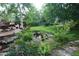 Lush backyard featuring a tranquil pond and deck area, perfect for relaxation at 248 Summit Trl, Broomfield, CO 80020
