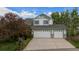 Charming two-story home with a three car garage and neutral colored exterior and well-manicured landscaping at 248 Summit Trl, Broomfield, CO 80020