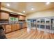 Well-lit kitchen with stainless steel appliances, wooden cabinetry, and views to the living space at 248 Summit Trl, Broomfield, CO 80020