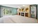 Inviting living room with fireplace, built-in shelving, and sliding glass door to the backyard at 248 Summit Trl, Broomfield, CO 80020