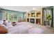 Cozy living room with a fireplace, built-in shelving, and sliding glass doors to the yard at 248 Summit Trl, Broomfield, CO 80020
