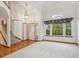 Bright and airy living room boasts hardwood floors, a vaulted ceiling, and large windows at 248 Summit Trl, Broomfield, CO 80020