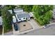 Aerial view of a single story home showcasing landscaped front yard and driveway parking at 3111 W Bails Pl, Denver, CO 80219