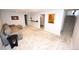 Finished basement with a comfortable seating area, neutral tones, and carpet flooring at 3111 W Bails Pl, Denver, CO 80219