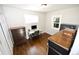 This well-lit bedroom has hardwood floors, and can easily be converted into a home office space at 3111 W Bails Pl, Denver, CO 80219