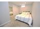 Cozy bedroom with plush carpet, a mirrored closet, and natural light from the window at 3111 W Bails Pl, Denver, CO 80219