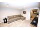 Finished basement area with carpet, lighting and egress window. Can easily be converted to a bedroom or office at 3111 W Bails Pl, Denver, CO 80219