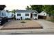 Charming home with manicured rock garden, well-maintained lawn, and RV parking at 3111 W Bails Pl, Denver, CO 80219