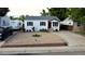 Charming single-story home with a gravel front yard, RV parking, and inviting curb appeal at 3111 W Bails Pl, Denver, CO 80219