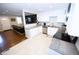 Modern open kitchen featuring sleek stainless steel appliances and beautiful countertops at 3111 W Bails Pl, Denver, CO 80219