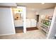 Convenient basement laundry area with washer, dryer, and easy access to the adjacent bathroom at 3111 W Bails Pl, Denver, CO 80219