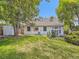 Well-maintained backyard with a grassy area, shed, and patio seating at 6379 S Jasmine Way, Centennial, CO 80111