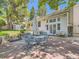 Spacious backyard patio with an umbrella, seating, and a well-maintained lawn at 6379 S Jasmine Way, Centennial, CO 80111