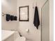 Bright bathroom showcasing modern art and sleek towel racks by the shower at 6379 S Jasmine Way, Centennial, CO 80111