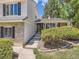 Inviting entrance with brick accents, stone walkway, and lush landscaping leading to the front door at 6379 S Jasmine Way, Centennial, CO 80111