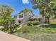 Well-manicured lawn and bushes surround this two-story home with a brick accent and a charming entrance at 6379 S Jasmine Way, Centennial, CO 80111