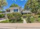 Two-story home with well-maintained front yard, mature trees, and inviting walkway leading to the front door at 6379 S Jasmine Way, Centennial, CO 80111