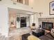 Inviting living room with a brick fireplace, built-in shelving, and comfortable seating at 6379 S Jasmine Way, Centennial, CO 80111