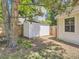 Backyard with a white storage shed next to a wood fence and the house at 6379 S Jasmine Way, Centennial, CO 80111