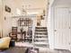 View of the carpeted staircase with white railings, leading to the upper level of the home at 6379 S Jasmine Way, Centennial, CO 80111