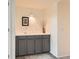 Stylish wet bar area with gray cabinets, a white countertop, and a modern faucet at 6379 S Jasmine Way, Centennial, CO 80111