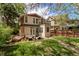 Backyard featuring a deck with seating and a lush lawn at 368 S Humboldt St, Denver, CO 80209