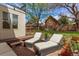 Relaxing backyard patio featuring lounge chairs, a brick surface and a beautiful yard at 368 S Humboldt St, Denver, CO 80209