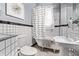 Bathroom features include a clawfoot tub, black-and-white tiles, a pedestal sink, and a leaf-themed art piece at 368 S Humboldt St, Denver, CO 80209