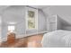 Cozy bedroom with hardwood floors, a large window, and built-in shelving at 368 S Humboldt St, Denver, CO 80209