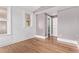 Bedroom with hardwood floors, neutral walls, and natural light from large windows at 368 S Humboldt St, Denver, CO 80209