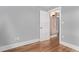 Spacious room features a hardwood floor, neutral paint, and an entrance to an adjacent room at 368 S Humboldt St, Denver, CO 80209