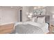 Comfortable bedroom features hardwood floors, closet, overhead lighting, and a decorative floral art piece at 368 S Humboldt St, Denver, CO 80209