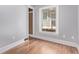 Bedroom with a hardwood floor, window, closet, and neutral paint at 368 S Humboldt St, Denver, CO 80209