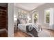 Cozy bedroom with a comfortable bed, soft lighting, and access to an outdoor balcony at 368 S Humboldt St, Denver, CO 80209