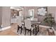 Inviting dining room with a rustic wooden table and modern upholstered chairs at 368 S Humboldt St, Denver, CO 80209