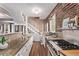 Well-lit kitchen showcasing countertops, stainless steel appliances, and a staircase at 368 S Humboldt St, Denver, CO 80209
