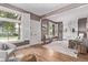 Bright living room featuring hardwood floors, large windows, and a decorative fireplace at 368 S Humboldt St, Denver, CO 80209