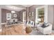 An open-concept living and dining room featuring hardwood floors and plenty of natural light at 368 S Humboldt St, Denver, CO 80209