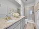 Neutral primary bathroom features double sinks, granite countertop and glass shower at 2059 S Vance Way, Denver, CO 80227