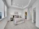 Bright and airy main bedroom features plush carpeting, lots of natural light, and tray ceilings at 2059 S Vance Way, Denver, CO 80227