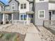 Inviting front entrance with a charming, cozy porch and stone landscaping at 2059 S Vance Way, Denver, CO 80227